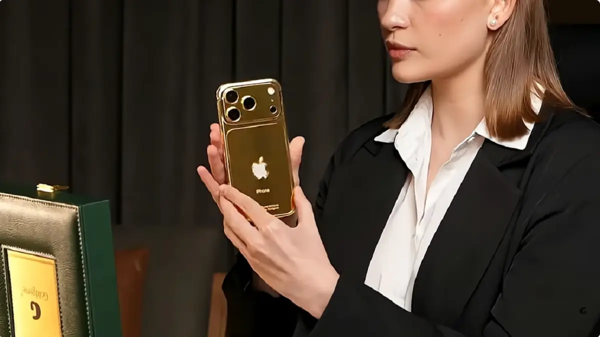 Handcrafted Goldgenie 24K Gold iPhone photographed with the Dubai skyline.