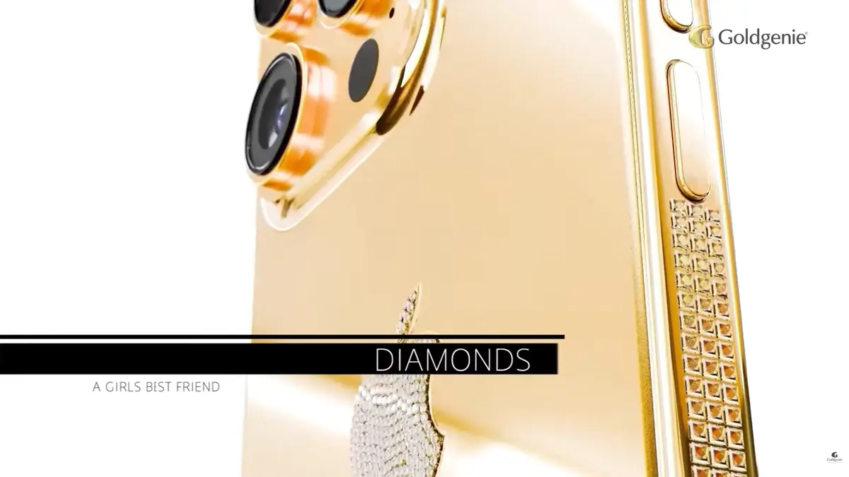 Successful entrepreneur holding a handcrafted Goldgenie luxury iPhone
