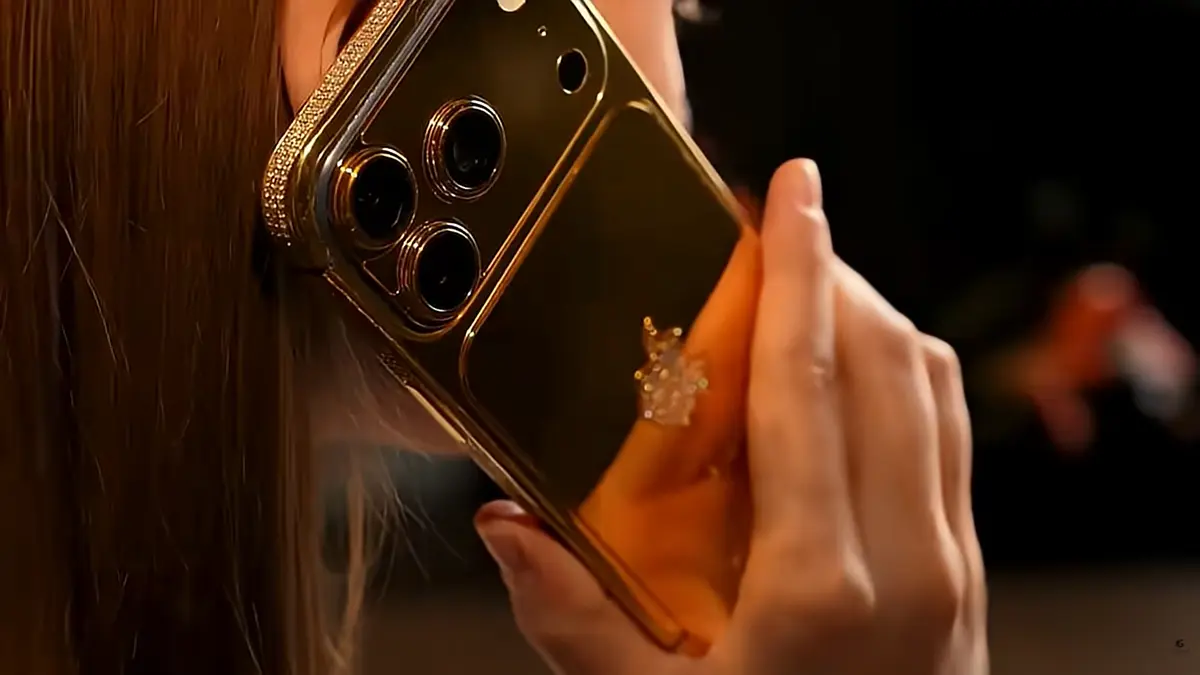 Goldgenie craftsman hand-finishing a luxury Gold iPhone.